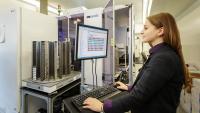 A researcher looks at data on a computer.